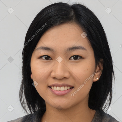 Joyful asian young-adult female with medium  black hair and brown eyes