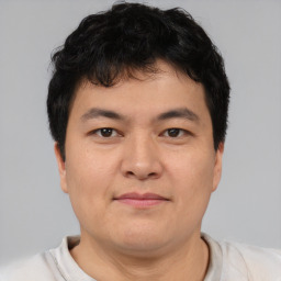 Neutral asian young-adult male with short  brown hair and brown eyes