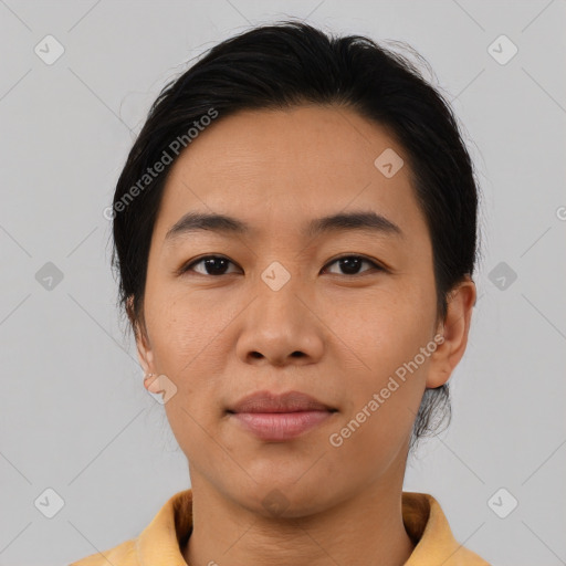 Joyful asian young-adult female with medium  brown hair and brown eyes