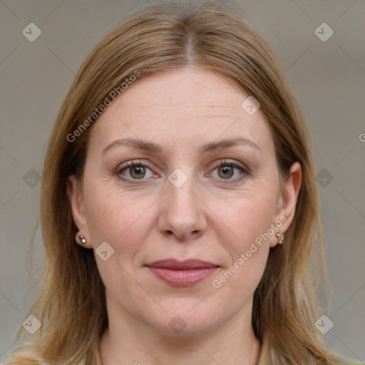 Joyful white adult female with medium  brown hair and blue eyes