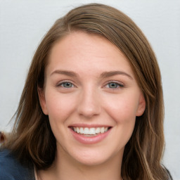 Joyful white young-adult female with long  brown hair and blue eyes