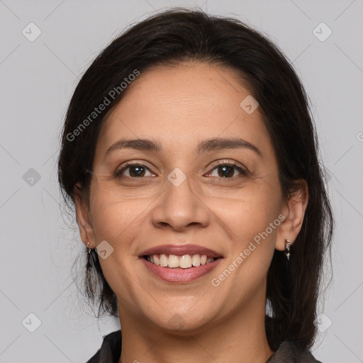 Joyful white adult female with medium  brown hair and brown eyes