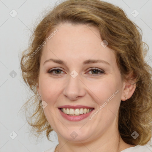 Joyful white adult female with medium  brown hair and blue eyes