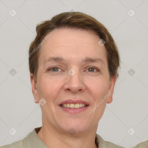 Joyful white adult female with short  brown hair and grey eyes