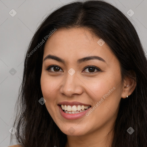 Joyful latino young-adult female with long  brown hair and brown eyes