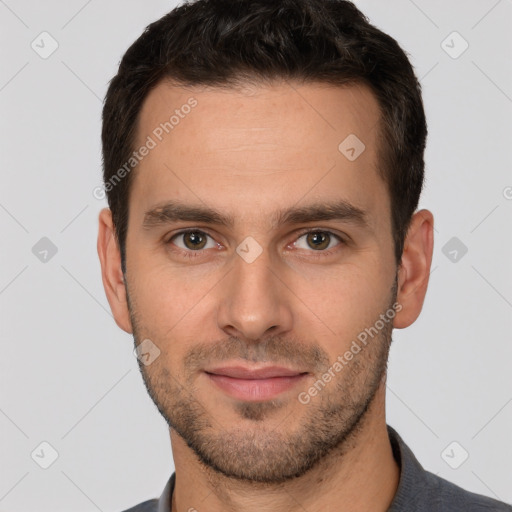 Joyful white young-adult male with short  brown hair and brown eyes