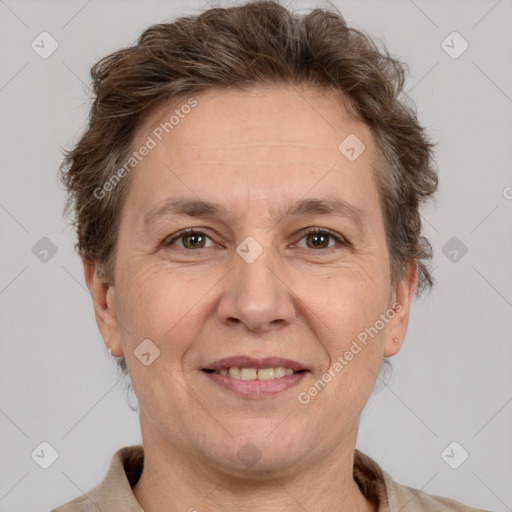 Joyful white adult female with short  brown hair and brown eyes