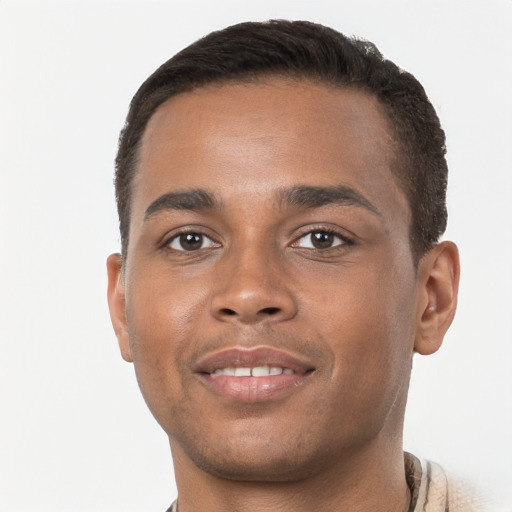 Joyful black young-adult male with short  brown hair and brown eyes