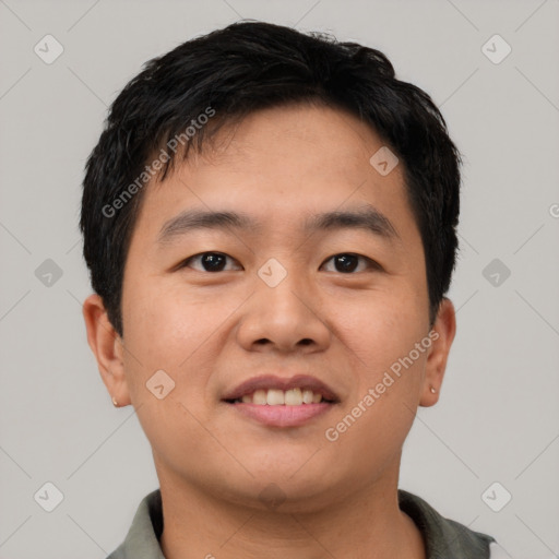 Joyful asian young-adult male with short  black hair and brown eyes