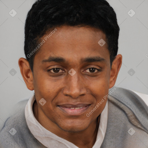Joyful black young-adult male with short  black hair and brown eyes