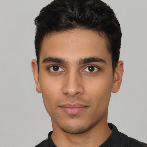 Neutral latino young-adult male with short  brown hair and brown eyes