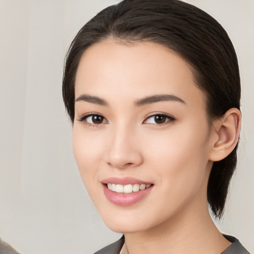 Joyful white young-adult female with medium  black hair and brown eyes