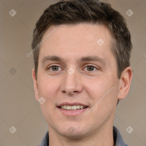 Joyful white adult male with short  brown hair and brown eyes