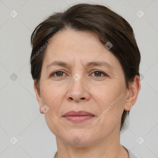 Joyful white adult female with short  brown hair and brown eyes