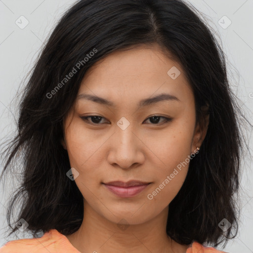 Joyful asian young-adult female with long  brown hair and brown eyes