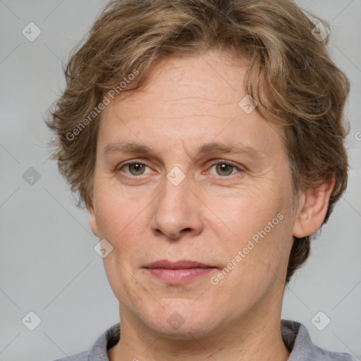 Joyful white adult female with short  brown hair and grey eyes