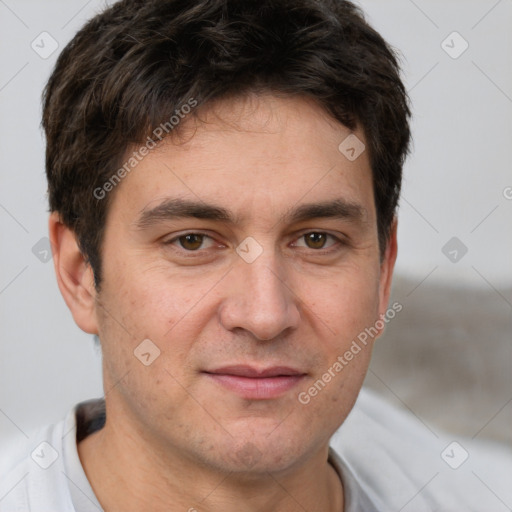 Joyful white adult male with short  brown hair and brown eyes