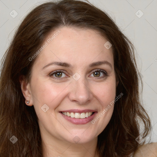 Joyful white young-adult female with long  brown hair and green eyes