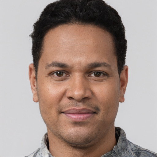 Joyful white adult male with short  brown hair and brown eyes