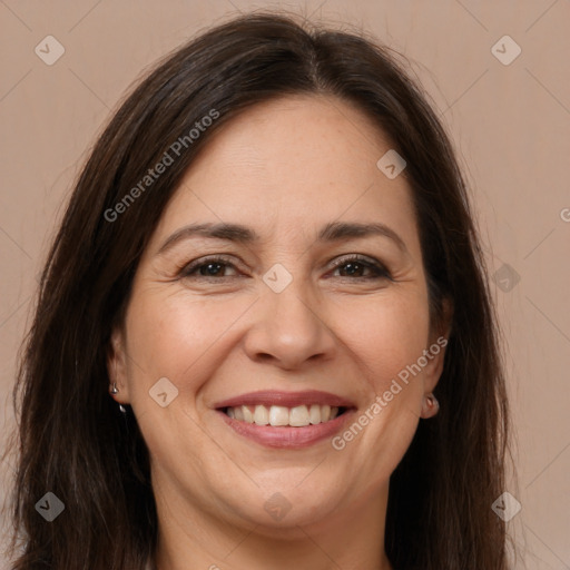 Joyful white adult female with long  brown hair and brown eyes