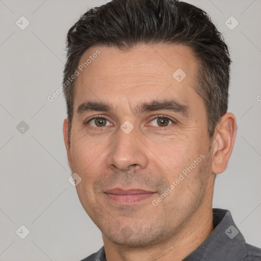 Joyful white adult male with short  brown hair and brown eyes