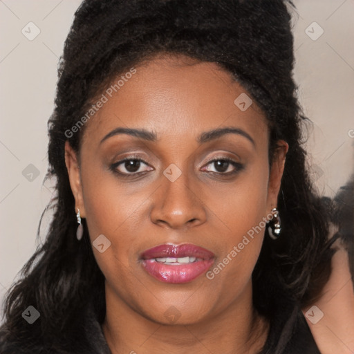 Joyful black young-adult female with long  brown hair and brown eyes