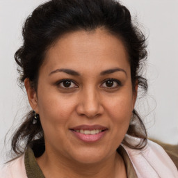 Joyful white adult female with medium  brown hair and brown eyes