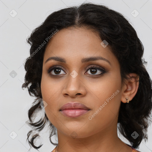 Joyful black young-adult female with medium  brown hair and brown eyes