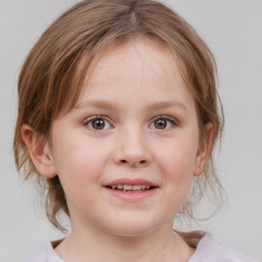 Joyful white child female with medium  brown hair and blue eyes