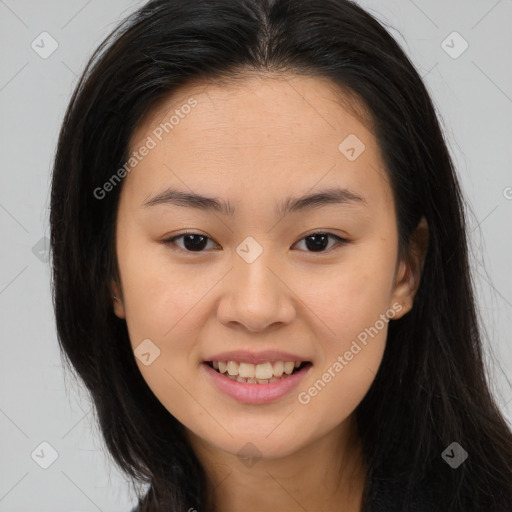 Joyful asian young-adult female with long  brown hair and brown eyes