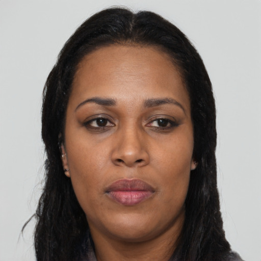 Neutral black adult female with long  brown hair and brown eyes