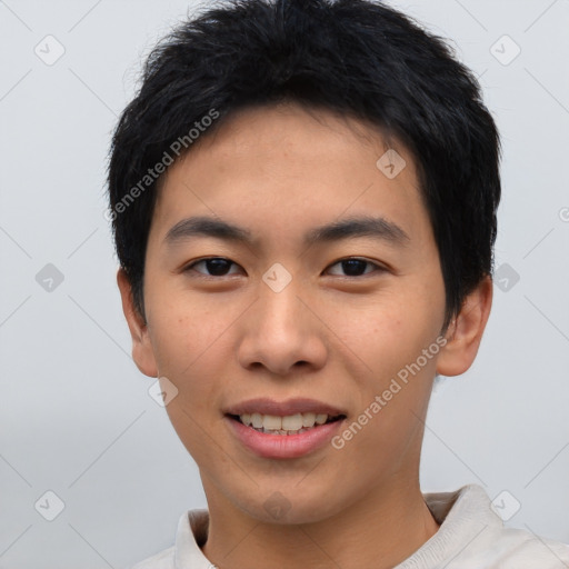 Joyful asian young-adult male with short  black hair and brown eyes