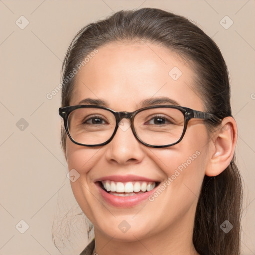 Joyful white young-adult female with medium  brown hair and brown eyes