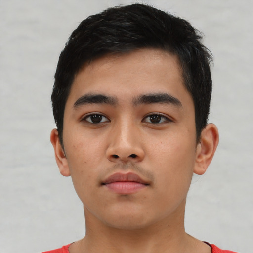 Neutral latino young-adult male with short  black hair and brown eyes