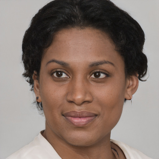 Joyful latino young-adult female with short  brown hair and brown eyes