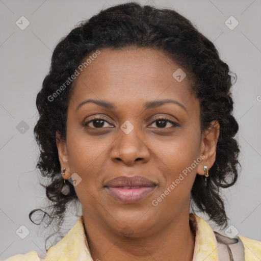 Joyful black adult female with medium  brown hair and brown eyes