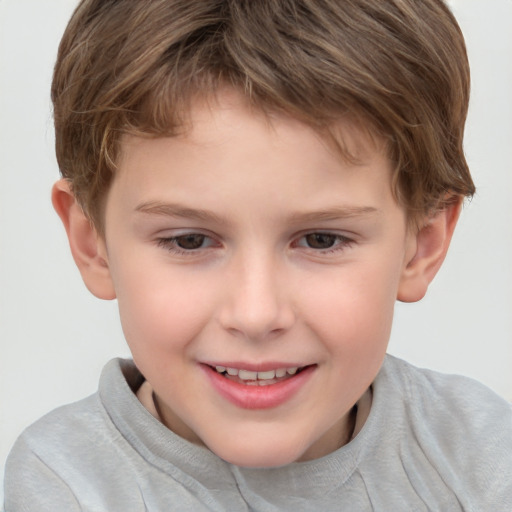 Joyful white child male with short  brown hair and brown eyes