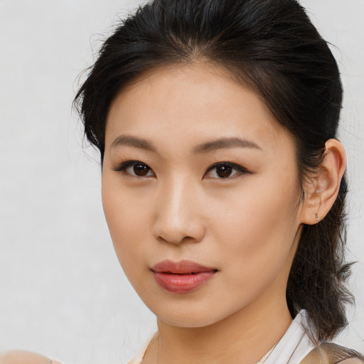 Neutral asian young-adult female with medium  brown hair and brown eyes
