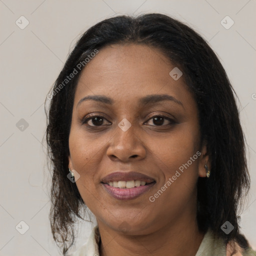 Joyful black adult female with medium  brown hair and brown eyes