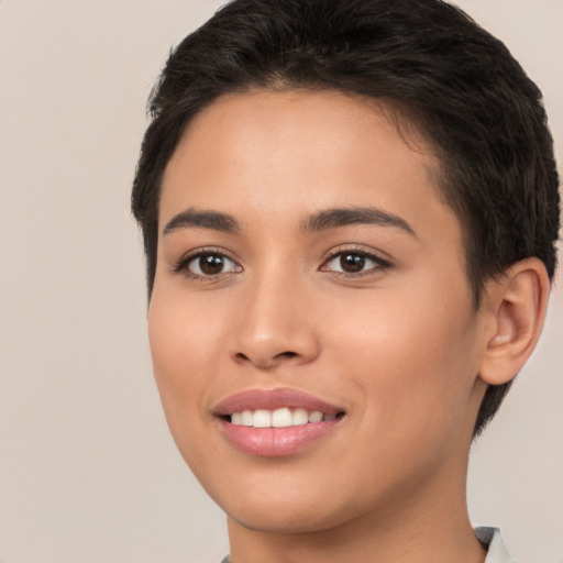 Joyful white young-adult female with short  brown hair and brown eyes