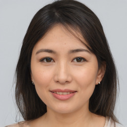 Joyful asian young-adult female with medium  brown hair and brown eyes