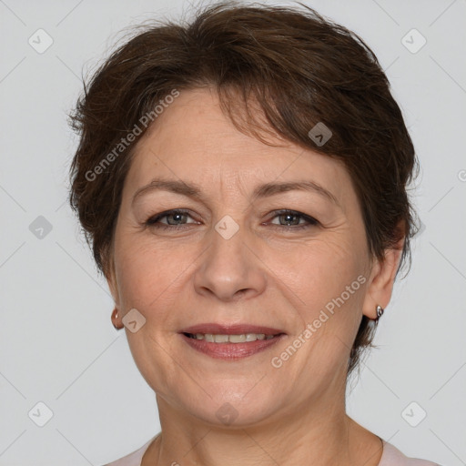 Joyful white adult female with short  brown hair and brown eyes