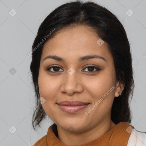 Joyful latino young-adult female with medium  brown hair and brown eyes