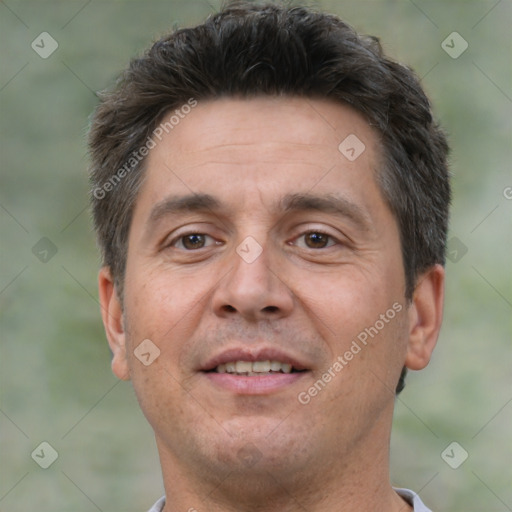 Joyful white adult male with short  brown hair and brown eyes