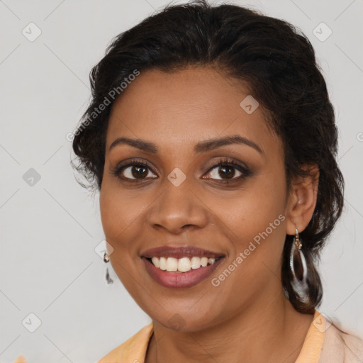 Joyful black young-adult female with medium  brown hair and brown eyes