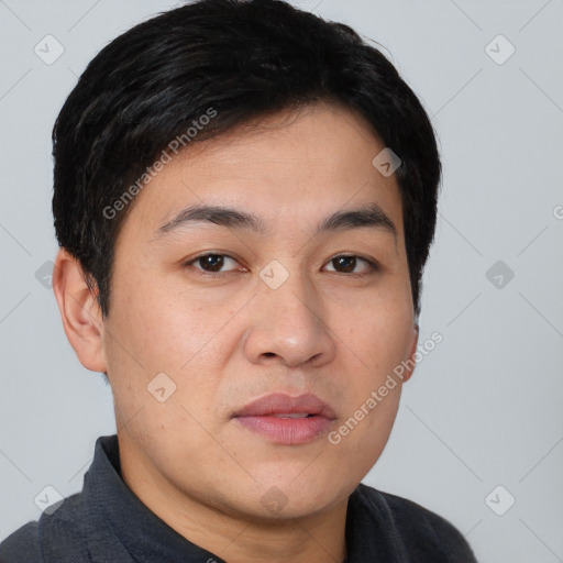 Joyful asian young-adult male with short  black hair and brown eyes