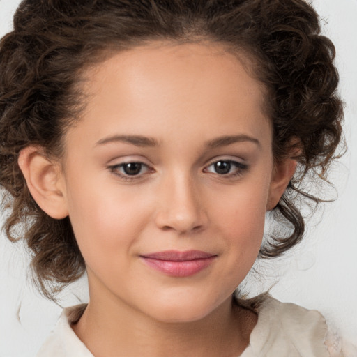 Joyful white child female with medium  brown hair and brown eyes