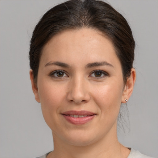 Joyful white young-adult female with medium  brown hair and brown eyes