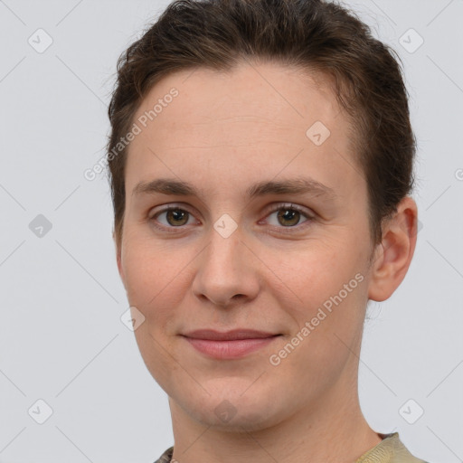 Joyful white young-adult female with short  brown hair and grey eyes