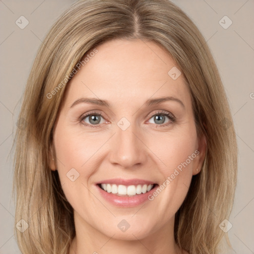 Joyful white young-adult female with long  brown hair and green eyes